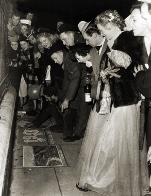 New Year revellers, London's West End are admiring the work of a pavement artist 1953